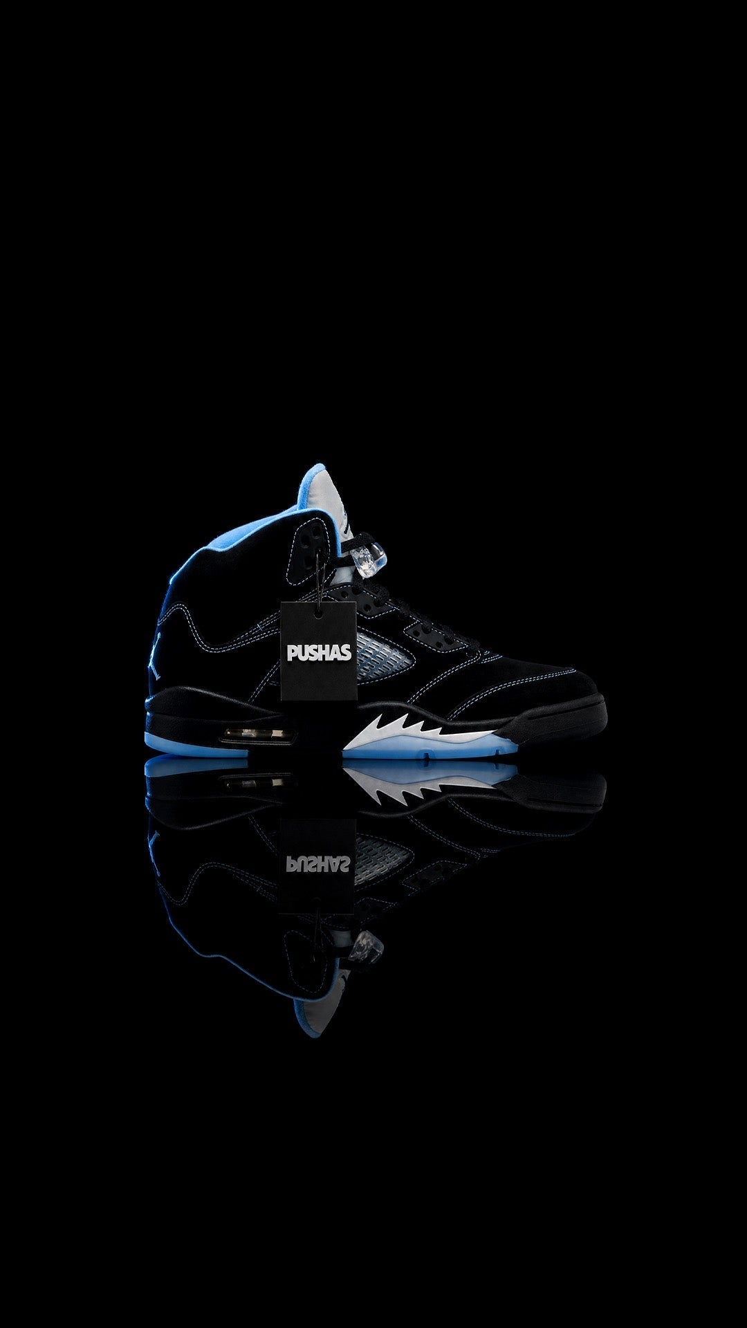 Air Jordan 5 Retro 'Black University Blue' (2026) on a dark reflective surface